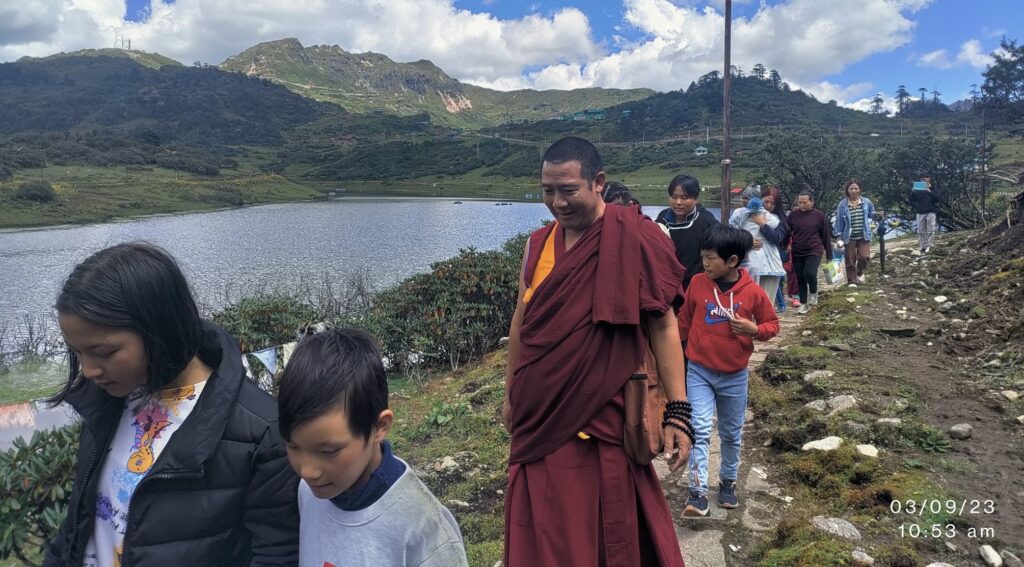 himalayan lhaksam founder walking along the children